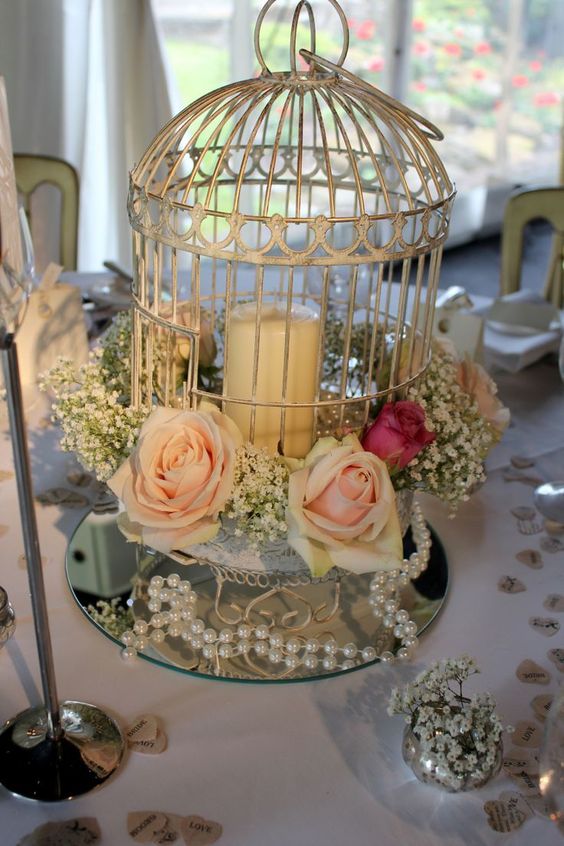 centro de mesa para boda con jaula y perlas