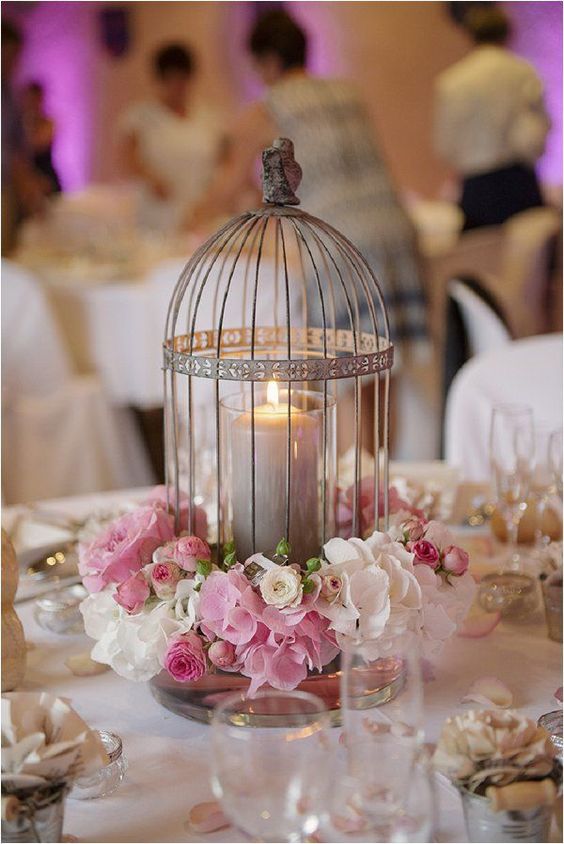 centro de mesa para boda con jaula y velas